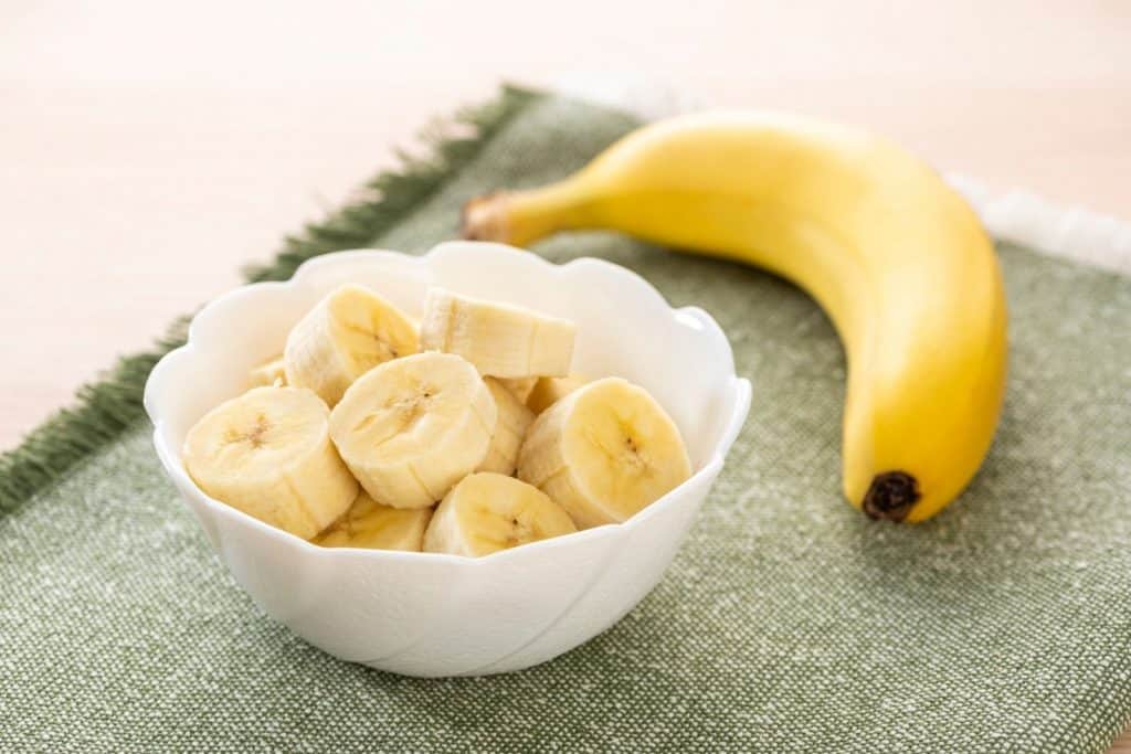fresh banana cuts in a white bowl