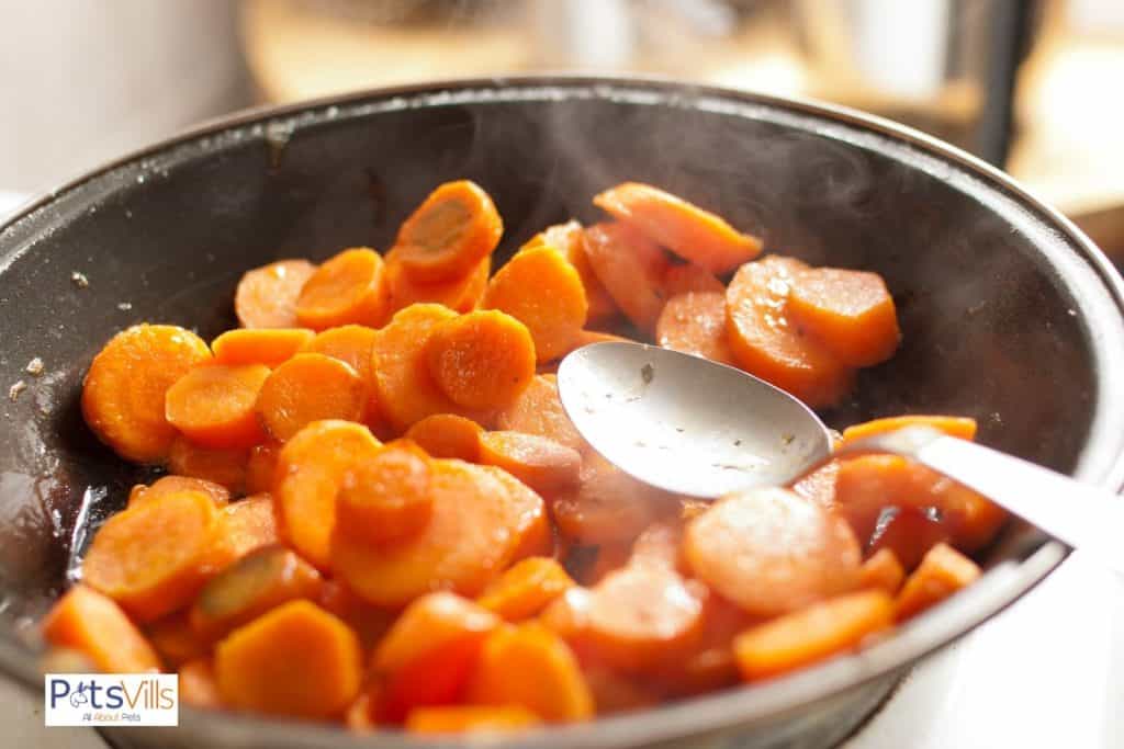 cooking carrots in a pan