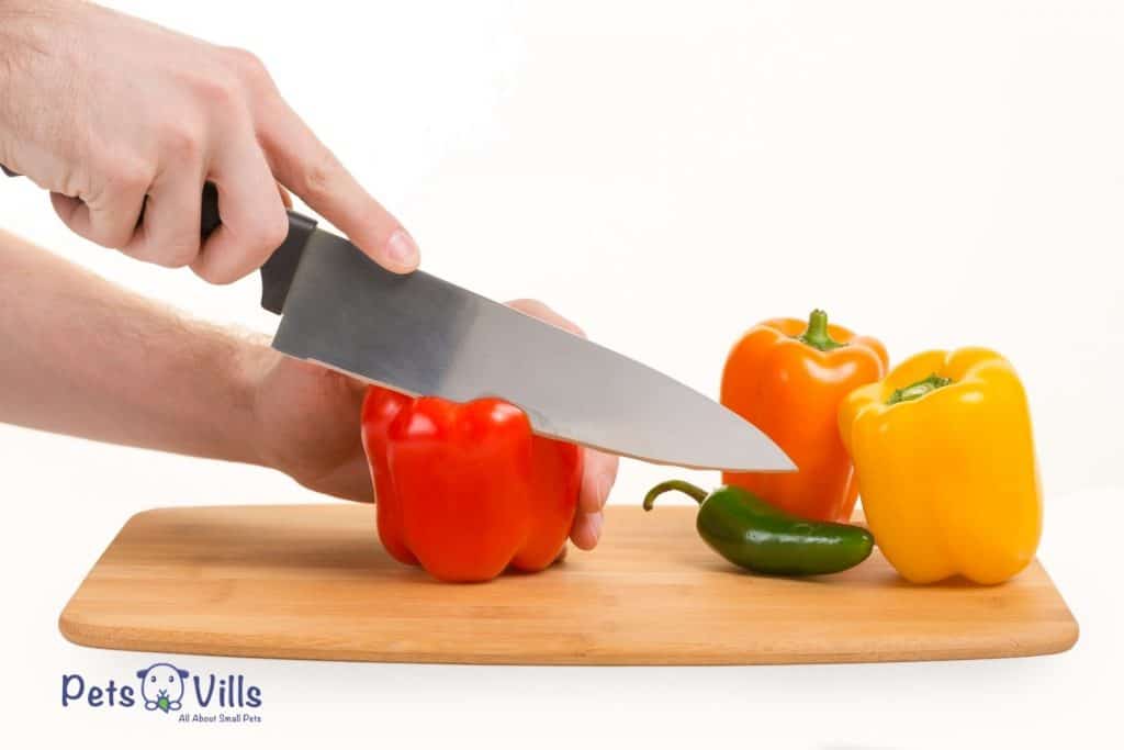 woman cutting bell peppers